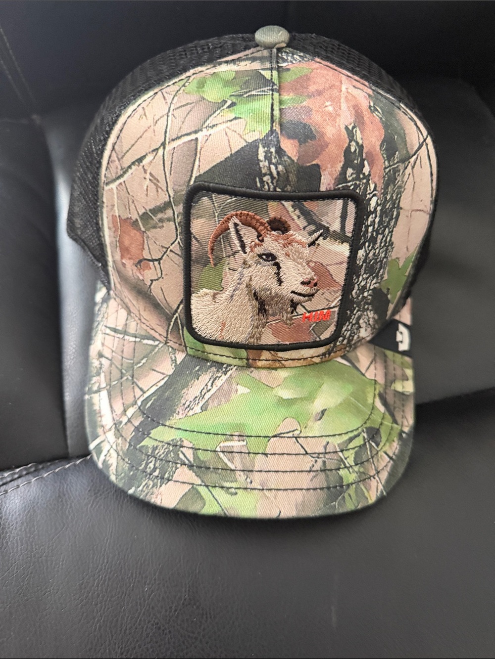 Goorin Bros Camo Goat Patch Trucker Hat in Green and Black. HIM